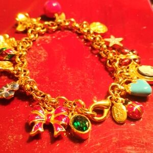 Joan Rivers gold bracelet with charms